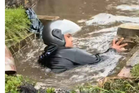 ‘I saw people struggling to get through’ – Young man praised for clearing drain amid flooding