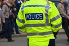 Two police officers among four arrested in fraud and bribery probe