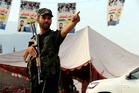 Pakistan vows to hunt down those behind suicide bombing as it holds funerals for victims