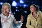 Miley Cyrus recalls last conversation with godmother Dolly Parton: “I’m just trying to keep myself together”