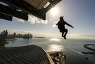 Man arrested after parachuting off rooftop of residential building in China