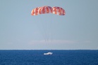 First manned Moon mission in more than 50 years splashes down after epic voyage