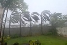 Flying tree limbs, collapsed buildings as major typhoon in Pacific bears down on remote US islands