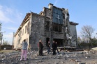 Russian attacks kill at least 2 as Ukraine strikes a Russian drone factory