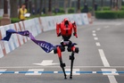 Robot breaks human half-marathon record in Beijing race