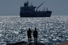 Iran war briefing: Trump’s claim causes spike in oil prices as Tehran issues warning