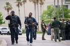 Authorities arrest one person and search for another, following deadly shooting at mall in Louisiana