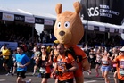 Tens of thousands pounding streets in record-breaking London Marathon