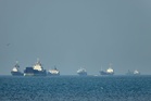 Bulk carrier catches fire after being struck by projectile off coast of Qatar, British military says