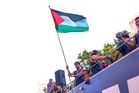 Barcelona star Lamine Yamal waves Palestinian flag during title parade