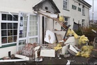 Man ploughs stolen bulldozer into village pub after taunts over marriage breakdown
