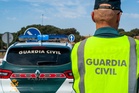 Man arrested on suspicion of killing parents and injuring four others in shooting spree in Spain