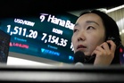 Asian shares surge after oil prices slip and Wall Street resumes its AI rally