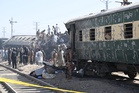 More than a dozen people dead as bomb blast in Pakistan overturns passenger train