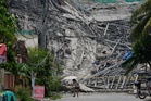Photos show the aftermath of a building collapse in the Philippines