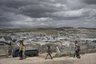 Cash-strapped Syrians living in tent settlements struggle to return home after Assad's fall