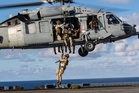Military has spent months building up ships and personnel in Caribbean and is ready for invasion of Cuba: report