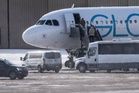 Several people rushed to Miami hospital after falling ill on plane belonging to airline used by ICE, report says
