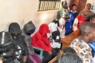 Students accused in Kenya school fire that killed 16 appear in court as parents await DNA results