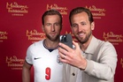 England captain Harry Kane reacts to seeing his own wax figure