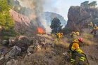 Spanish wildfires force residents to flee their homes as huge flames tear through region