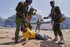 Kenya protesters clash with police over proposed Ebola center for US citizens, in photos