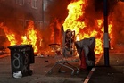 Belfast stabbing latest: Several homes on fire as protesters clash with police after knife attack