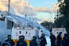 Belfast riots latest: Police fire water cannon at protesters as projectiles hurled at officers