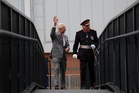 Impromptu walkabout by the King cheers crowds on rainy day