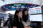 Asian shares surge and oil prices slip after Trump claims a breakthrough in Iran war talks