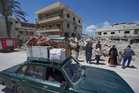 Lebanese return home to destruction after word of an initial US-Iran deal, in photos