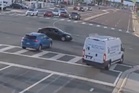 Heart-stopping moment red light runner misses car by inches after driving through intersection