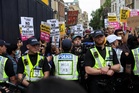 Tommy Robinson speaks to half-empty hall as protesters block Oxford Union debate