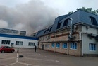 Clouds of black smoke rise over Moscow after Ukrainian drones hit an oil refinery