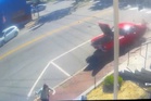 Woman almost flattened by speeding car after it mounts sidewalk