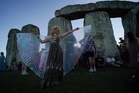 Welcoming the longest day at Stonehenge, in photos