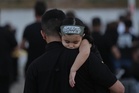 Shiite Muslims collectively mourn to mark Muharram and Ashoura