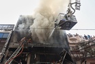 Major fire at India coaching centre kills at least 15 as fleeing students jump from building