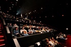 Gen Z’s newest fad is watching TV in movie theaters. Here’s why