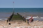 June temperature record broken as UK swelters in exceptional heat