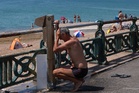 Brits warned to ‘drink responsibly’ and avoid exercising outside during record-breaking heatwave