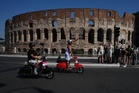 Photos show Vespa enthusiasts buzzing through Rome celebrating the little scooter's 80th anniversary