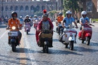 More than 15,000 Vespas from across the world swarm Rome as iconic scooter celebrates anniversary