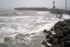 Two tropical storms pound Japan, causing flooding and landslides