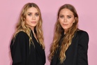Mary-Kate and Ashley Olsen make a rare public appearance at family wedding