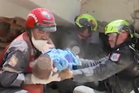 Rescue teams pull baby alive from beneath rubble after earthquake in Venezuela