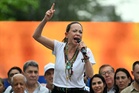 Venezuela’s opposition leader in exile says she will do ‘whatever it takes’ to return to help earthquake victims