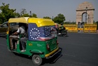 Why Trump’s face can be seen zooming in and out of India’s rush-hour traffic