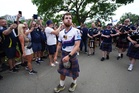 Tartan Army fan who raised £1m for charity in 3,000-mile US walk returns home