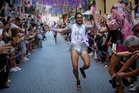 People race through Madrid in high heels during Pride, in photos